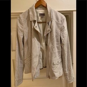 Cute ruffle back lined jacket. Steam and go for work play. Cute with jeans!.